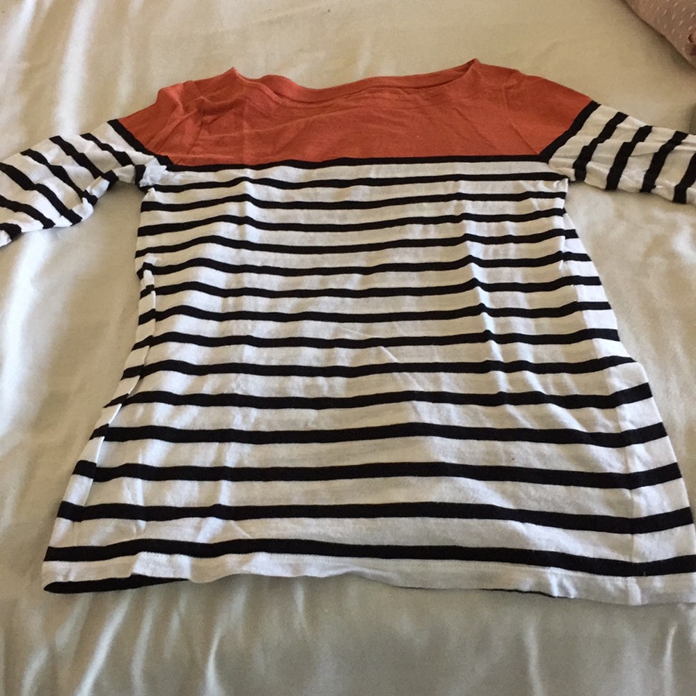 Orange/white striped shirt.